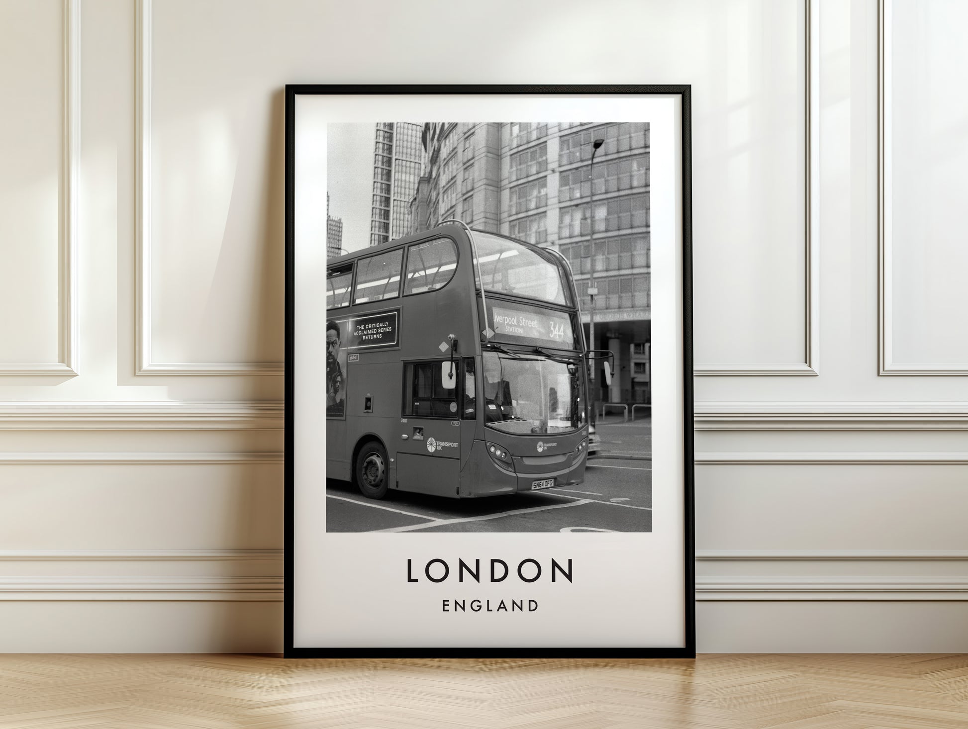 London Bus Black and White City Street - London analogue photography poster print on white panelled wall