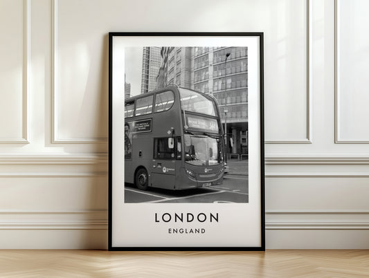 London Bus Black and White City Street - London analogue photography poster print on white panelled wall